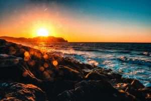 Image of a sunset over a beach